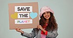 Climate change, smile and save the planet poster with a woman in studio on a gray background. Portrait, recycle or global warming with a young poster on earth day for sustainability or ecology