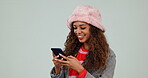 Funny, woman and typing with phone on social media, website or app with meme, video or online joke with gen z humor. Laughing, emoji and college student in studio reading cellphone blog or news post