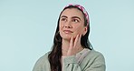 Thinking, face and woman confused in studio with why, questions or brainstorming on blue background. Idea, strategy and female model with choice, decision or hearing gossip, news and problem solving