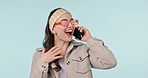 Fashion, news and woman with wow phone call in studio for sale, promotion or sign up deal on blue background. Smartphone, surprise and female winner excited for giveaway, prize or membership discount