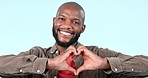 Heart, hands and face of man in studio for peace, kindness and charity donation on blue background. Portrait, happy african model and sign of love, hope and thank you for support, emoji and review 