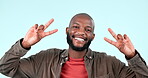 Peace, smile and face of man in studio for winning, success and feedback of vote on blue background. Portrait, african model and emoji of v sign for victory, hope or icon of freedom, support or pride