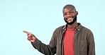 Pointing, excited or face of black man by offer, discount deal or retail sale on studio space or logo advertising. Smile, show or happy person with mockup, news or menu promotion on blue background