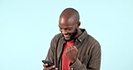 Man, phone and celebration in studio for success, promotion or competition at work on white background with happiness. Person, fist and smartphone for conversation, and winning with goals in morning