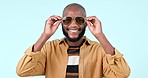 Sunglasses, smile and face of black man in a studio with stylish, cool and trendy fashion. Happy, style and confident young African male model with edgy face accessory isolated by white background.