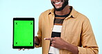 Green screen, tablet mock up and pointing in studio with website, internet and social network. Hand, ui and closeup of person with technology tracking markers, advertising or app on blue background
