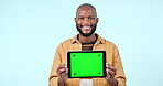 Tablet mock up, green screen and a man in studio with website, internet and social network. Smile, ui and a black person with technology tracking markers, advertising or app on blue background