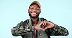 Smile, black man and face with a heart for travel, hiking or trekking on a studio background. Happy, vacation and portrait of an African person with an emoji gesture or shape for care and holiday