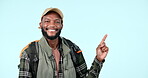 Happy black man, backpack and pointing in advertising or marketing against a studio background. Portrait of African male person, tourist or hiker show notification, alert or list for travel on mockup