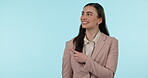 Pointing finger, happy and a business woman in studio for review, advertising or announcement. Portrait of a professional person with hand gesture, presentation or promotion offer on blue background