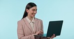 Smile, typing and business woman on laptop in studio isolated on blue background mockup space. Happy professional on computer, online and consultant reading email on internet, social media and search