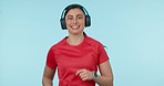 Happy woman, fitness and running with headphones in sports motivation against a studio background. Active female person, athlete or runner smile for exercise, workout or training on mockup space