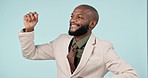 Businessman, celebration and dance for success or winning a bonus, deal or achievement in studio on blue background. Happy, black man and excited energy for professional career milestone or mockup