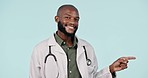 Happy black man, doctor and pointing in advertising, list or steps against a studio background. Portrait of African male person or medical healthcare professional showing process on mockup space