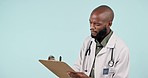 Black man, doctor and writing on clipboard for prescription, checklist or results against a studio background. African male person, medical or healthcare worker taking notes for inspection on mockup