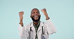 Celebration, fist pump and man doctor in a studio with success or achievement for good news. Happy, excited and young African male healthcare worker with job promotion isolated by white background.