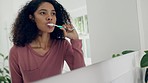 Dental, bathroom mirror or woman brushing teeth with toothbrush, toothpaste and home morning routine. Reflection, self care or person cleaning mouth, gum or plaque for oral shine, hygiene or wellness