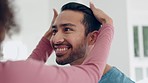 Hair, love and happy man with wife in the bathroom for a morning grooming routine on a weekend. Hygiene, smile and young couple doing a self care treatment together for health, wellness or bonding.