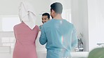 Back, talking and morning with a couple in the bathroom together for a grooming routine in their home. Mirror, health or love with a man and woman getting ready while grooming for skincare in a house