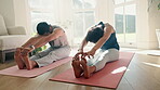 Couple, yoga and stretching for home fitness, exercise and holistic training on living room floor of healing and peace. Calm, mindfulness and young people in pilates workout, legs or muscle wellness