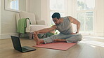 Man, yoga and stretching on computer for home training, fitness and holistic or wellness in virtual class or video streaming. Young person on floor for workout, exercise and muscle health on laptop