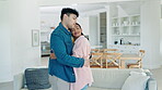 Dance, happy and love with couple in living room for freedom, trust and celebration. Music, relax and romance with man and woman hugging at home for wellness, commitment and marriage together