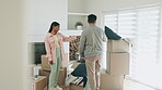 Couple, new home and boxes for moving, living room planning and talking of ideas for property or real estate. Happy interracial people unboxing cardboard and furniture for house, lounge or apartment