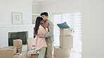 Couple, dancing and kiss to celebrate new home or moving in together with real estate property. A happy man and woman dancer with love and romance in first house with mortgage, boxes and investment 