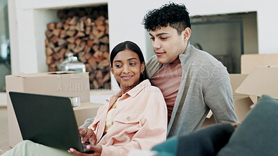 Couple, tablet and laptop in planning, new home or moving in with boxes ...