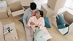 Happy couple, real estate and phone in relax, planning or moving in new home together above in living room. Top view of man and woman with boxes in property investment, online or house renovation