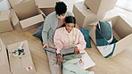 Happy couple, real estate and laptop with boxes in planning, renovation or moving in new home together above. Top view of man and woman in property plan, investment or house relocation on technology