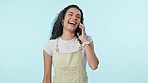 Woman, laugh and phone call conversation in studio for discussion, communication and mobile contact on blue background. Happy model, cellphone and news of funny joke, social networking and connection