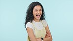 Arms crossed, face and a laughing woman on a studio background for positive attitude and a joke. Happy, young and portrait of a girl or person with confidence, comedy and funny youth or teen