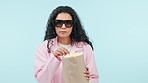 Mockup space, movie and woman with popcorn, eating and scared on a blue studio background. Face, person and model with a snack, film and sunglasses with video, wow and chilling with food and cinema