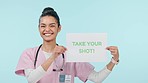 Happy nurse, face and vaccination sign of a woman show wellness, healthcare and shot banner. Vaccine, information and portrait with health opinion, message and medical advice with blue background