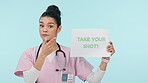 Nurse, face and vaccination sign of a woman pointing to wellness, healthcare and shot banner. Vaccine, information and portrait with health opinion, message and medical advice with blue background