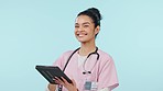 Face of woman on tablet, happy nurse and research in studio isolated on a blue background mockup space. Portrait, smile and medical professional on technology, telehealth and scroll on healthcare app