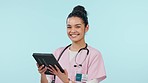 Face of woman on tablet, nurse smile and research in studio isolated on a blue background mockup space. Portrait, happy and medical professional on technology, telehealth and scroll on healthcare app