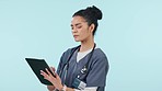Woman, doctor and tablet in medical research, healthcare results or Telehealth against a studio background. Female person or nurse working on technology in online search or networking on mockup space