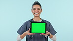 Happy woman, nurse and tablet with green screen in advertising on mockup against a studio background. Portrait of female person, doctor or medical healthcare worker with technology, app or display