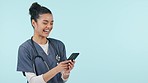 Happy woman, doctor and phone in studio, social media scroll and laughing at meme, post and mockup. Smile, smartphone and medical professional on mobile app for fun video streaming on blue background