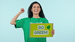 Protest, sign and climate change, woman and green with global warming awareness and activism on blue background. Sustainability, cleaning environment and planet, poster and fight for change in studio