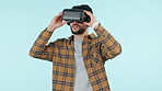 Man, virtual reality and futuristic glasses in software development, gaming test or user experience on blue background. Business person in VR technology, developer startup project or vision in studio