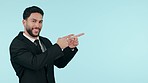Happy businessman, advertising and pointing to mockup space, list or deal against a studio background. Portrait of male person or business employee show notification, sale or discount in marketing
