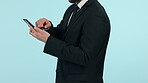Businessman, phone and hands typing in social media, communication or networking against a studio background. Closeup of male person or business employee scrolling on mobile smartphone app on mockup
