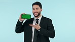 Corporate worker, phone green screen and presentation, website sign up information and advertising in studio. Face, business man and mobile mockup, pointing you and tracking marker on blue background