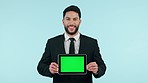 Businessman, tablet and green screen in studio for marketing or advertising tracking markers on blue background. Smile, person and digital tech with product placement or design for social media web