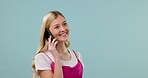 Woman, phone call and communication in studio, happy with smile and smartphone with chat on blue background. Mockup space, funny conversation and VOIP with technology, networking and connection
