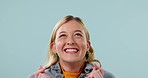 Excited, hope and face of woman on blue background for good news, announcement and winning. Happy, facial expression and portrait of person with excitement, waiting and wow for celebration in studio