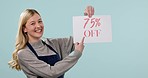 Excited business owner, sale sign or woman in studio on blue background for 75 percent off. Wow, face or happy person pointing to poster paper for retail discount marketing or Advertising promotion